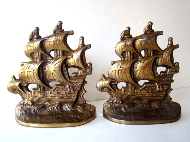 A pair of antique bookends inscribed "Spanish Galleon" made by the Connecticut Foundry in 1928